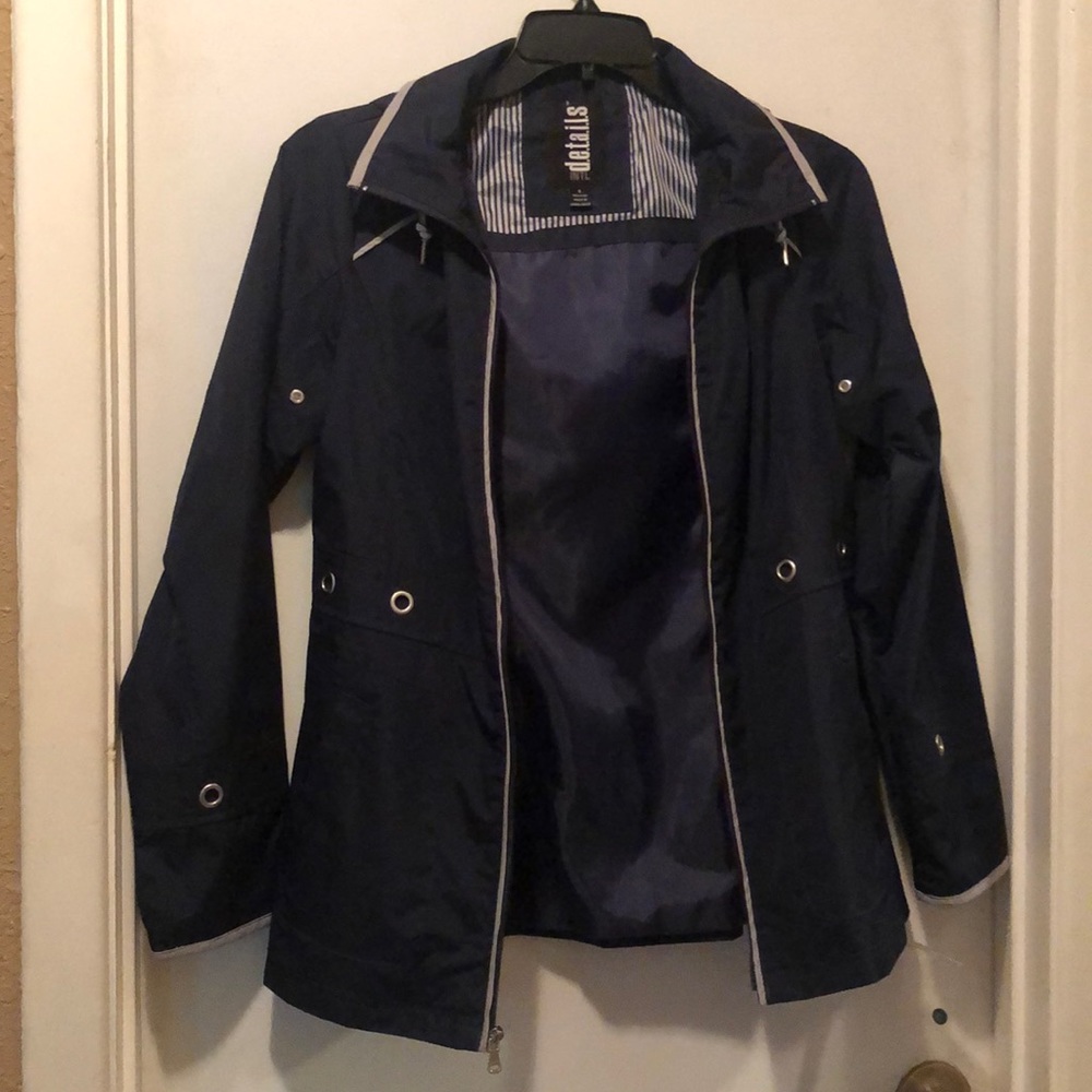 NWOT Never Worn INTL d.e.t.a.i.l.s Navy Jacket with hood. Lots of details.
